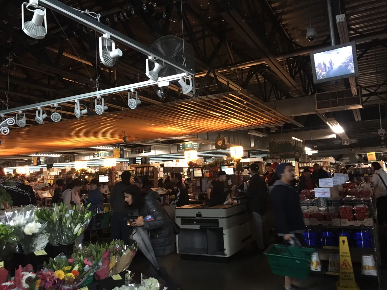 Berkeley Bowl West with emergency lighting, but the cash registers are still working in power outage.